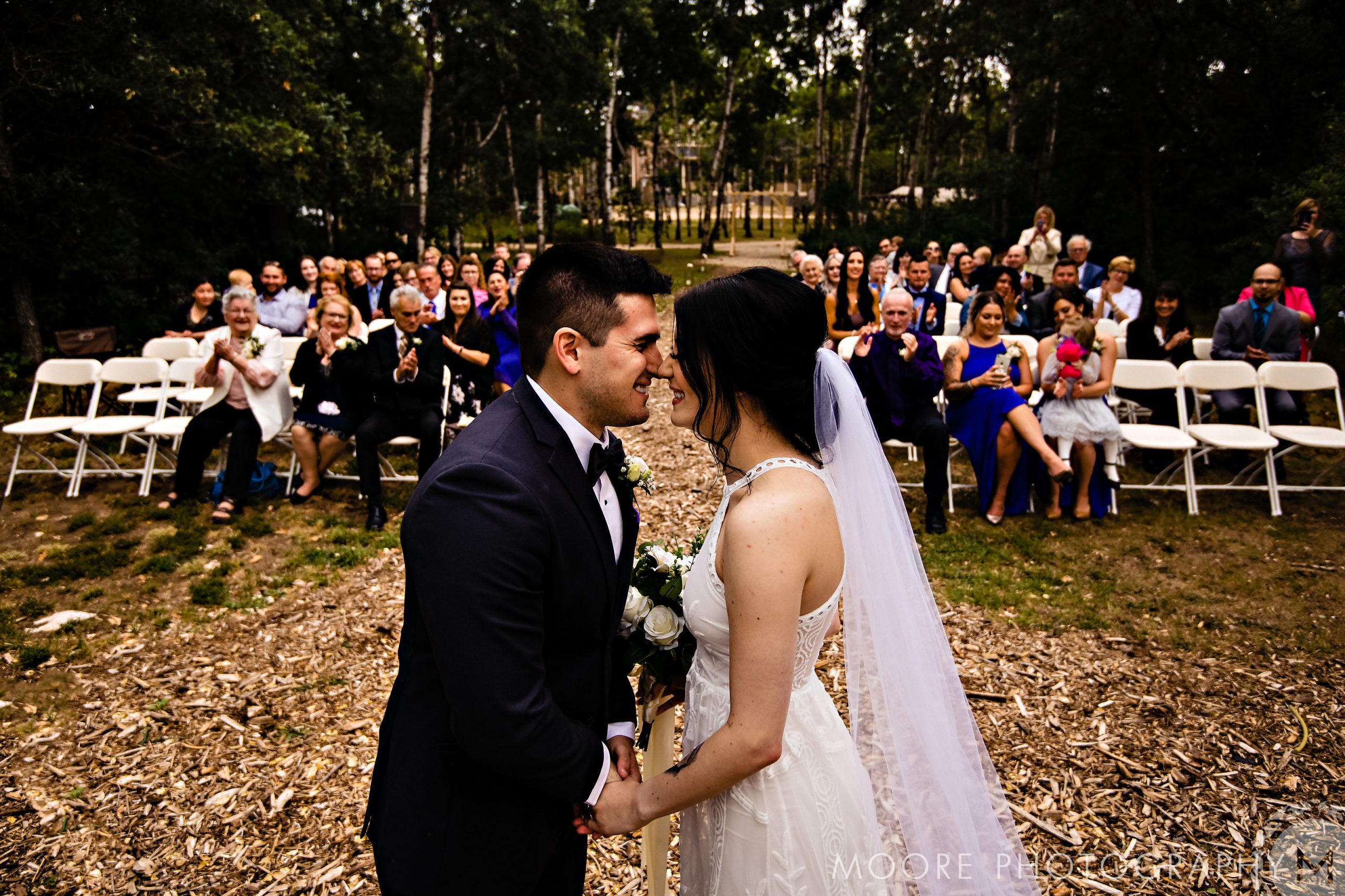 Bride and groom smiling at each other at charming Winnipeg wedding venues.
