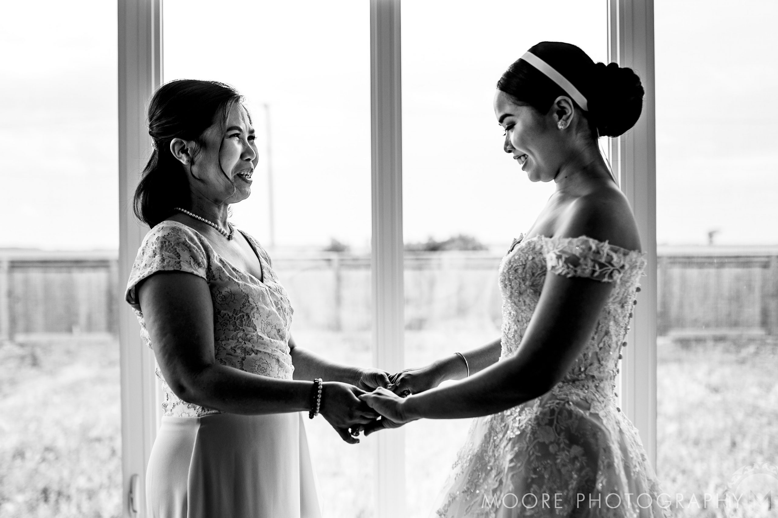 a mother and daughter sharing a moment before their wedding in winnipeg