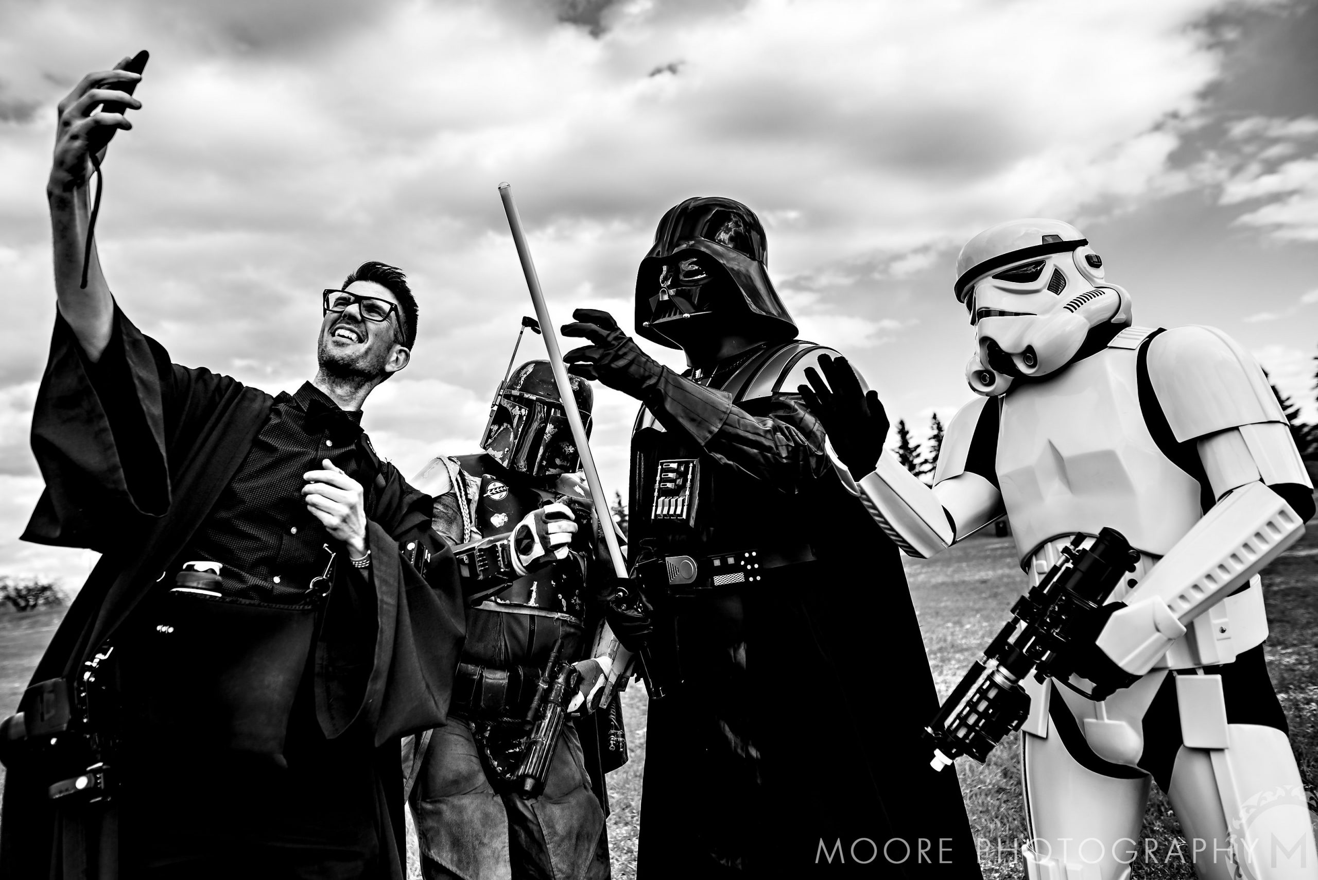 Star Wars fans in costumes take a selfie, like a scene from Winnipeg wedding venues.
