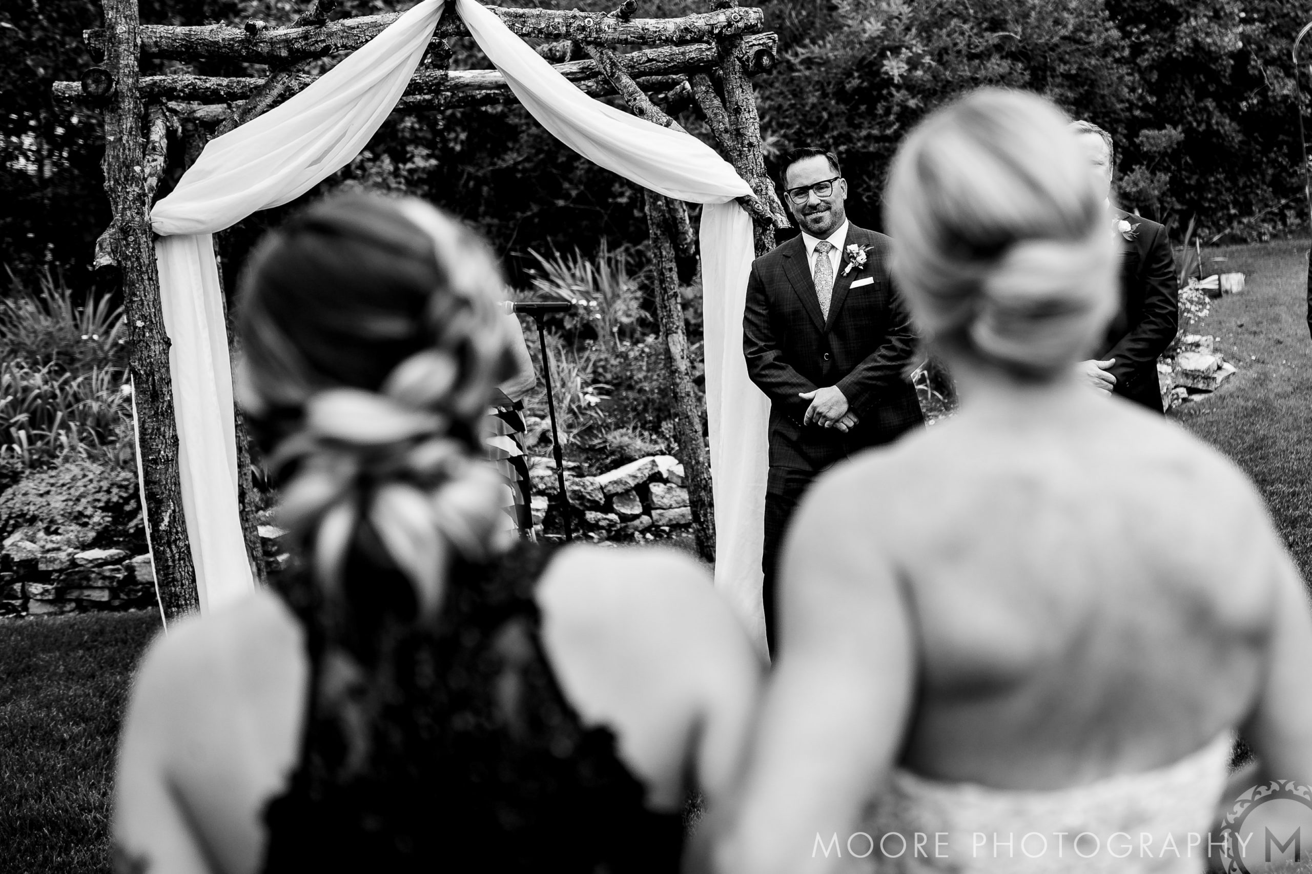 The bride and groom shine at a rustic altar, framed by Winnipeg wedding venues' charm.