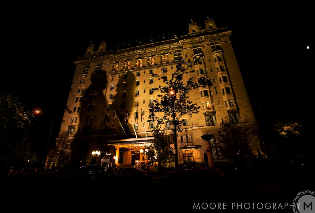 Illuminated Winnipeg wedding venue with an ornate facade and grand entrance at night.