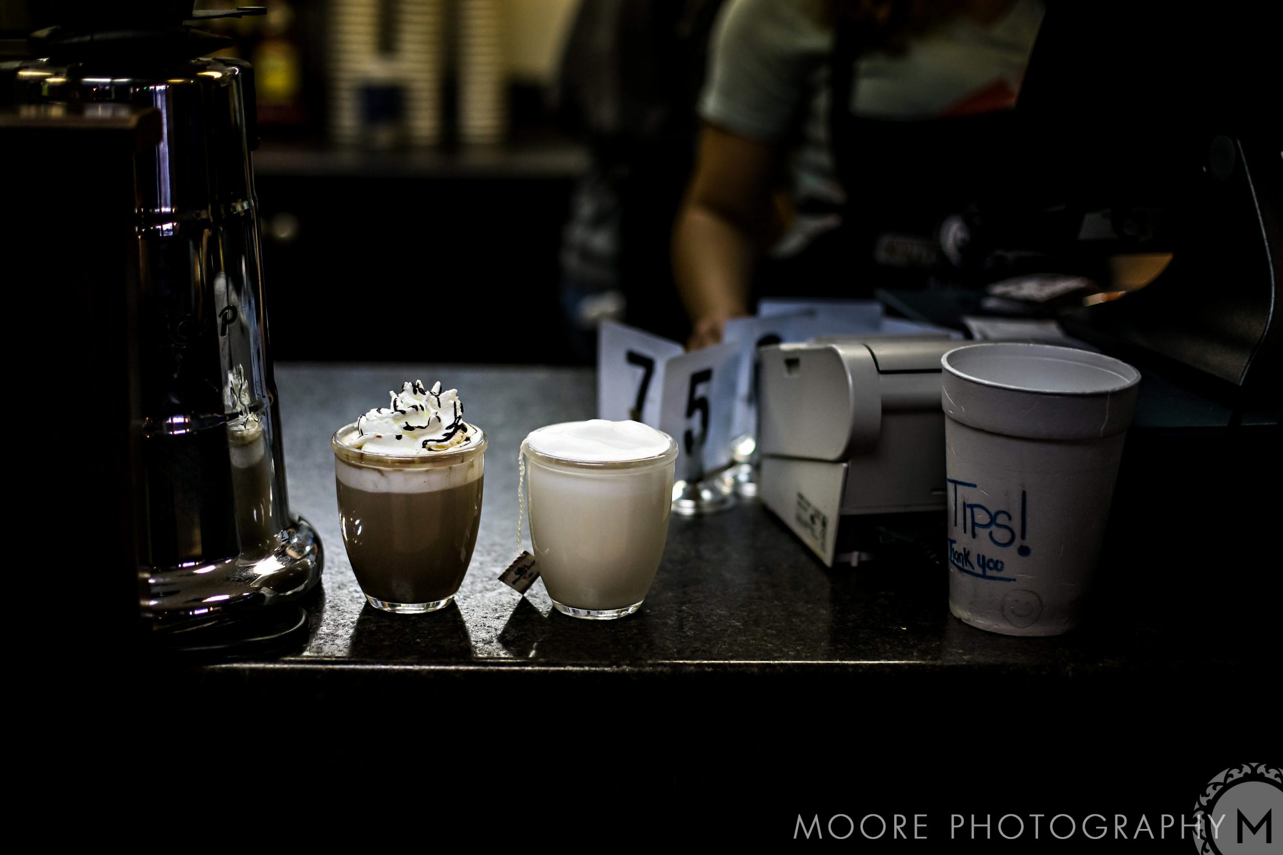 Two cups of foamy coffee, like a relaxed café engagement, await on the counter in Winnipeg.