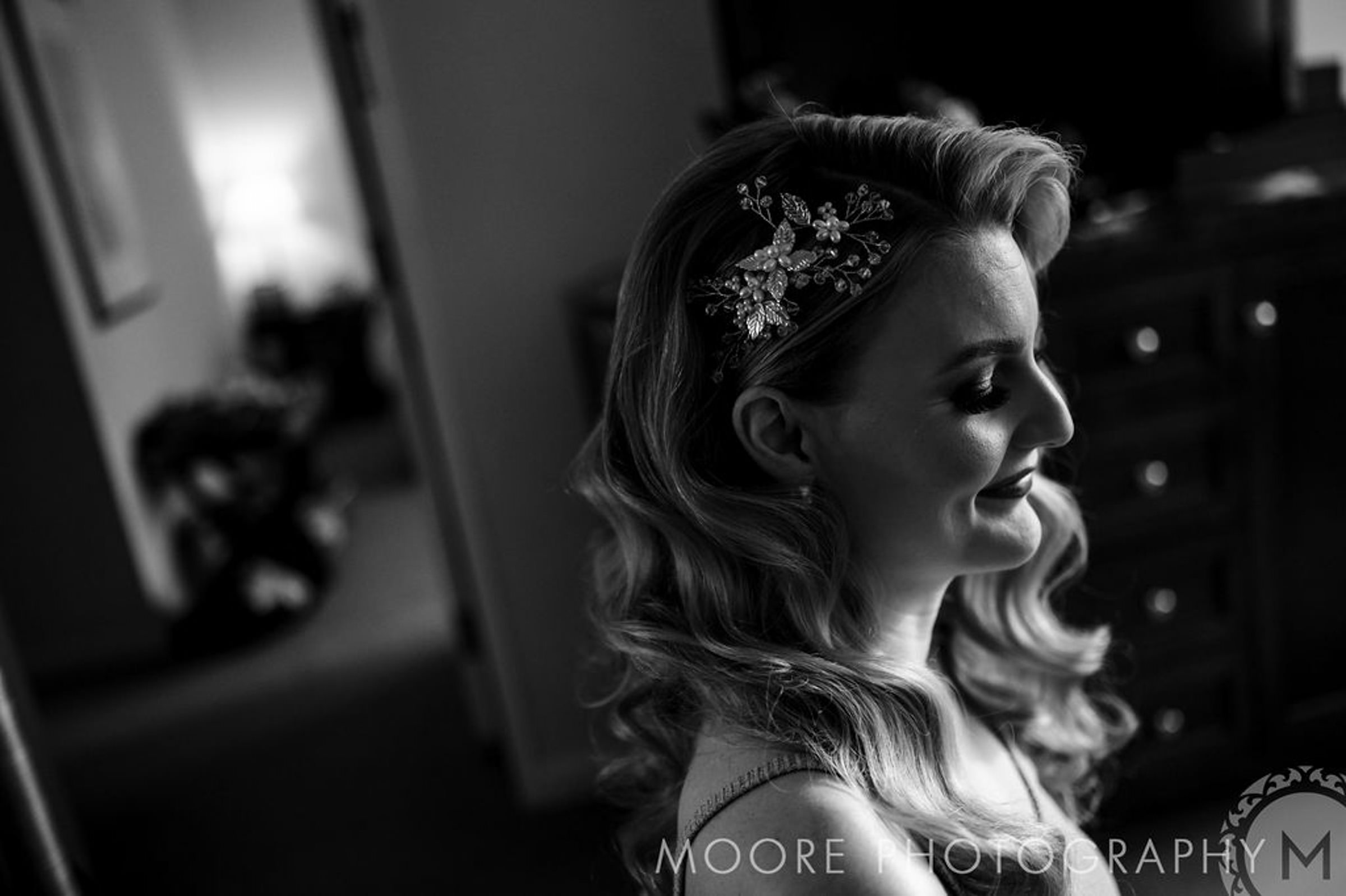 Black and white photo of a woman with wavy hair at Winnipeg wedding venues.