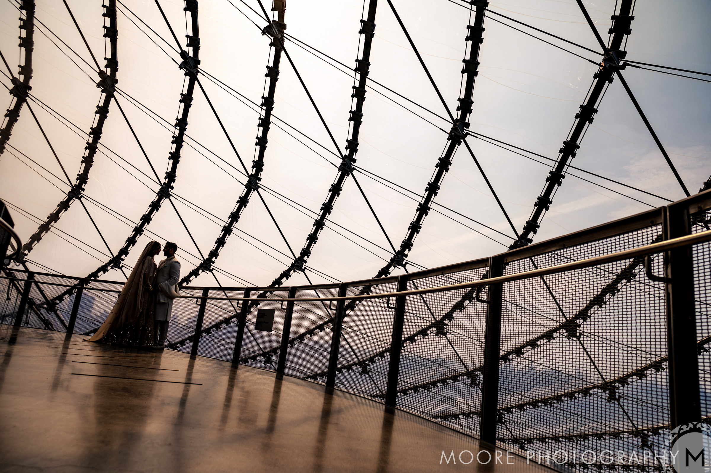 Silhouetted couple stands on observatory deck, a hidden gem among Winnipeg wedding venues.