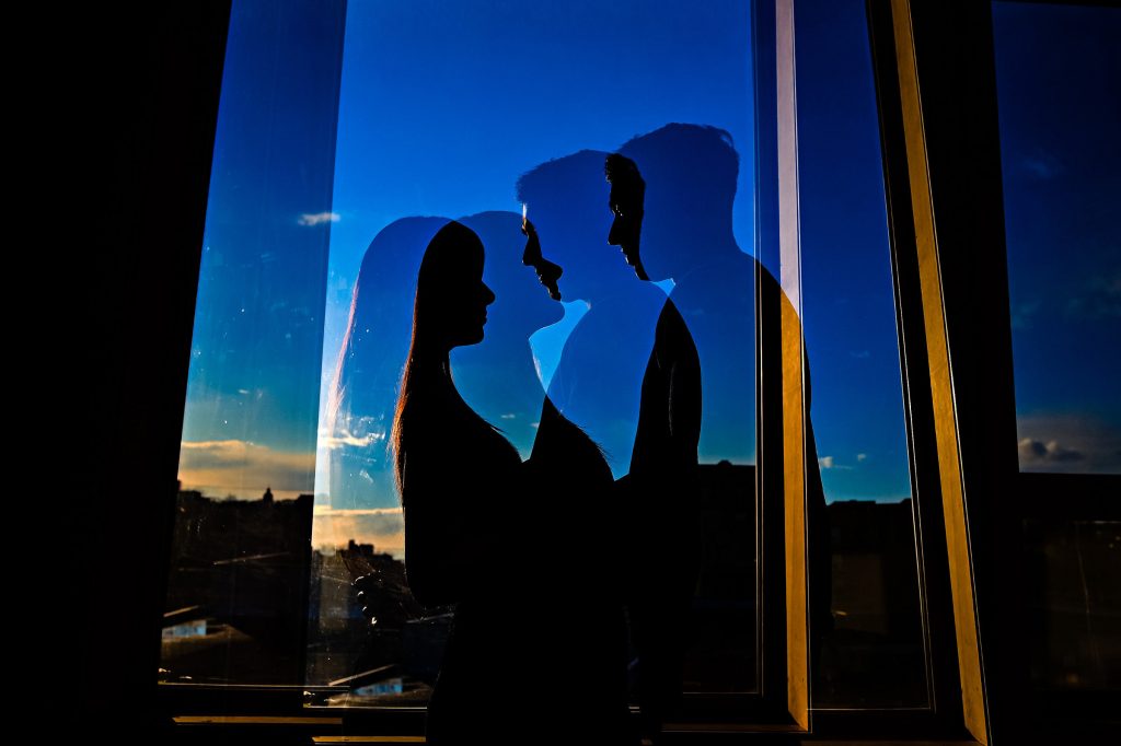 Add bride and groom in a romantic pose in darkness photograph inside Allure Studios in downtown Winnipeg