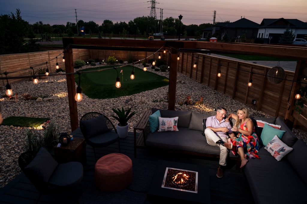 And engaged in their backyard during sunset, having a drink