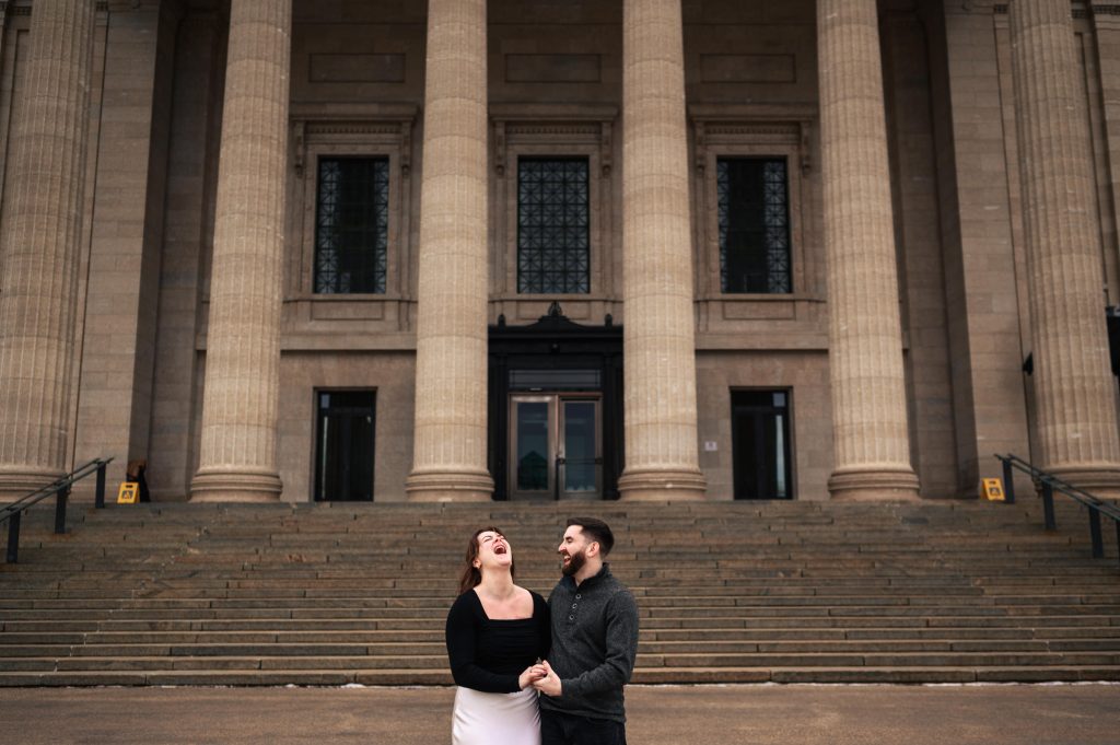 And engaged, laughing, and holding hands in front of the Winnipeg legislative building