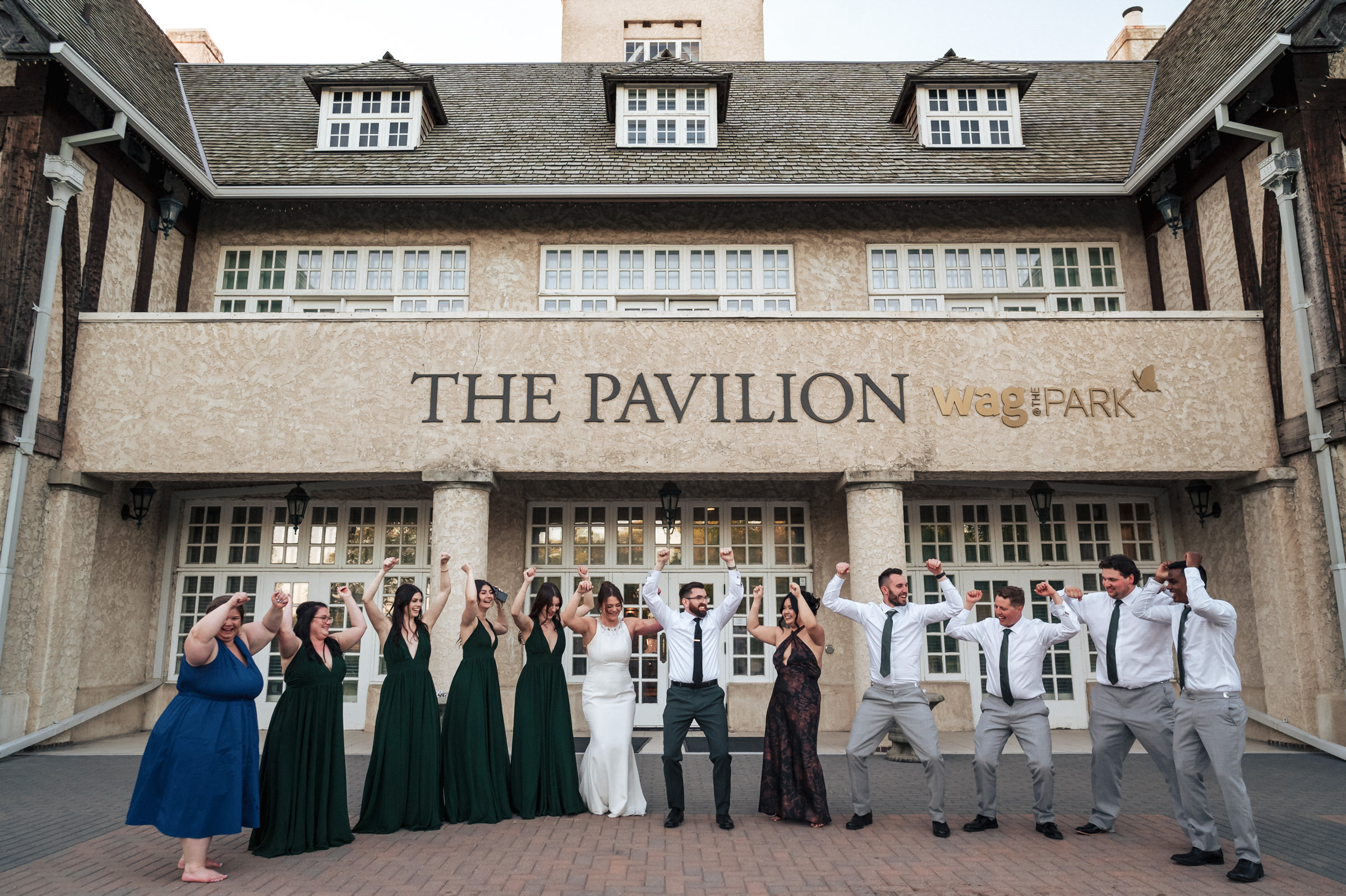 Joy abounds as the wedding party celebrates at Winnipeg's "The Pavilion" venue.