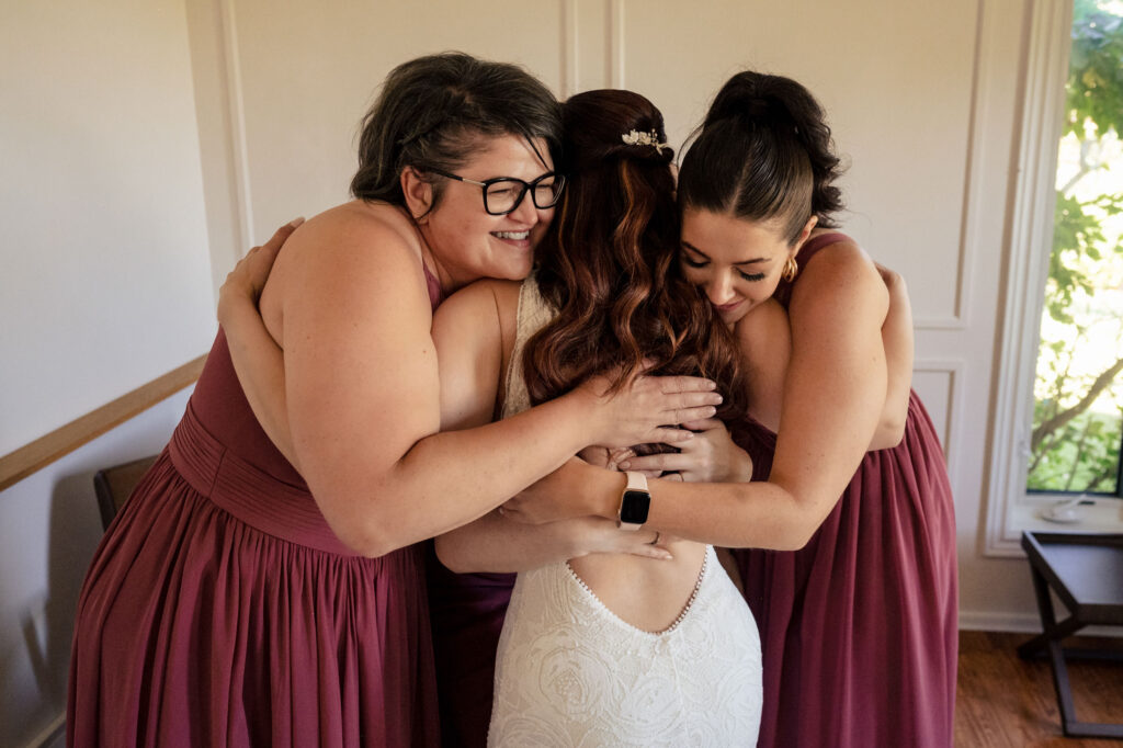 a bride being hugged