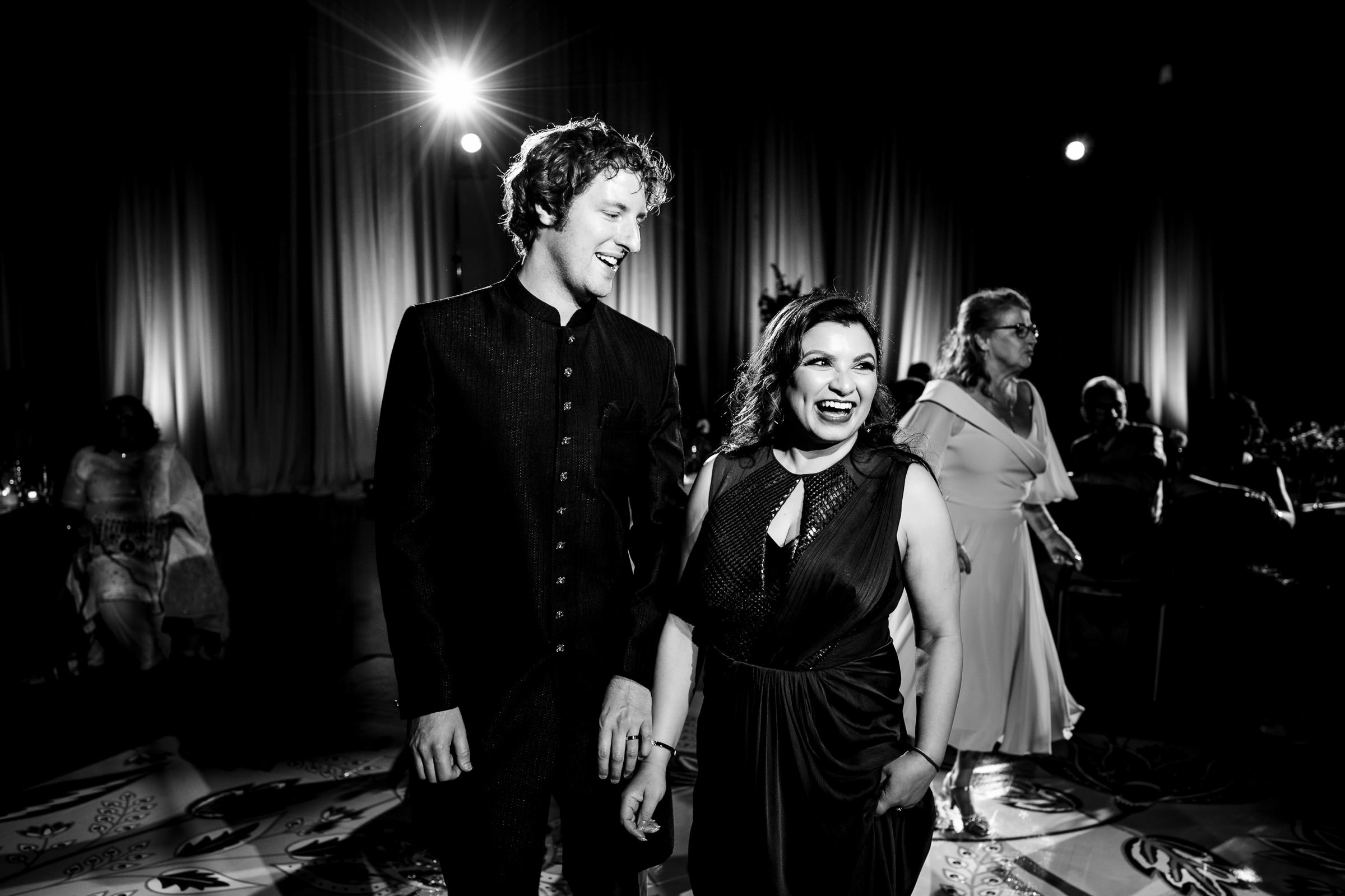 A black and white photo of a couple smiling at a Winnipeg wedding.