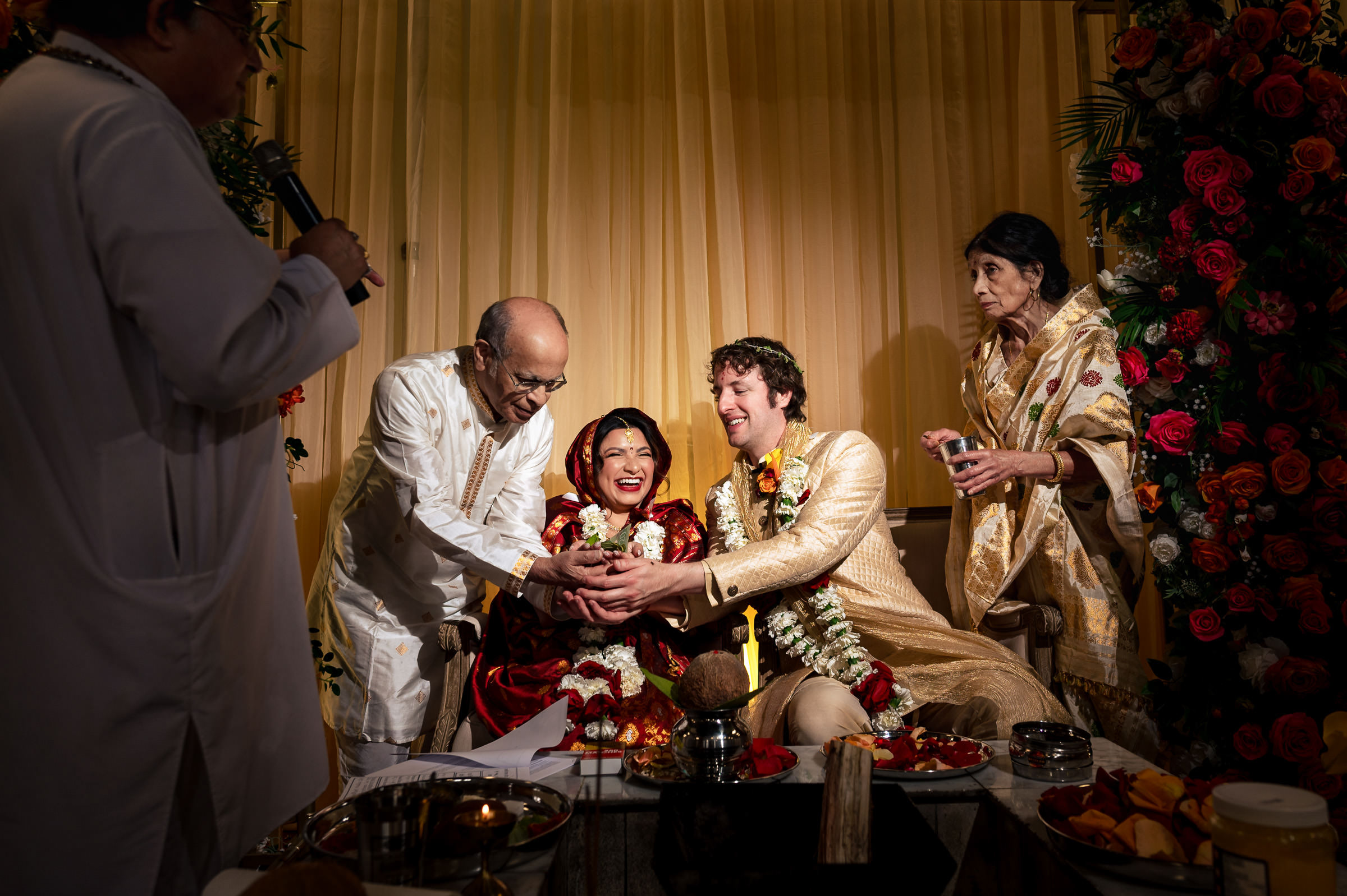 A couple celebrates their Winnipeg wedding with family and vibrant floral decorations.