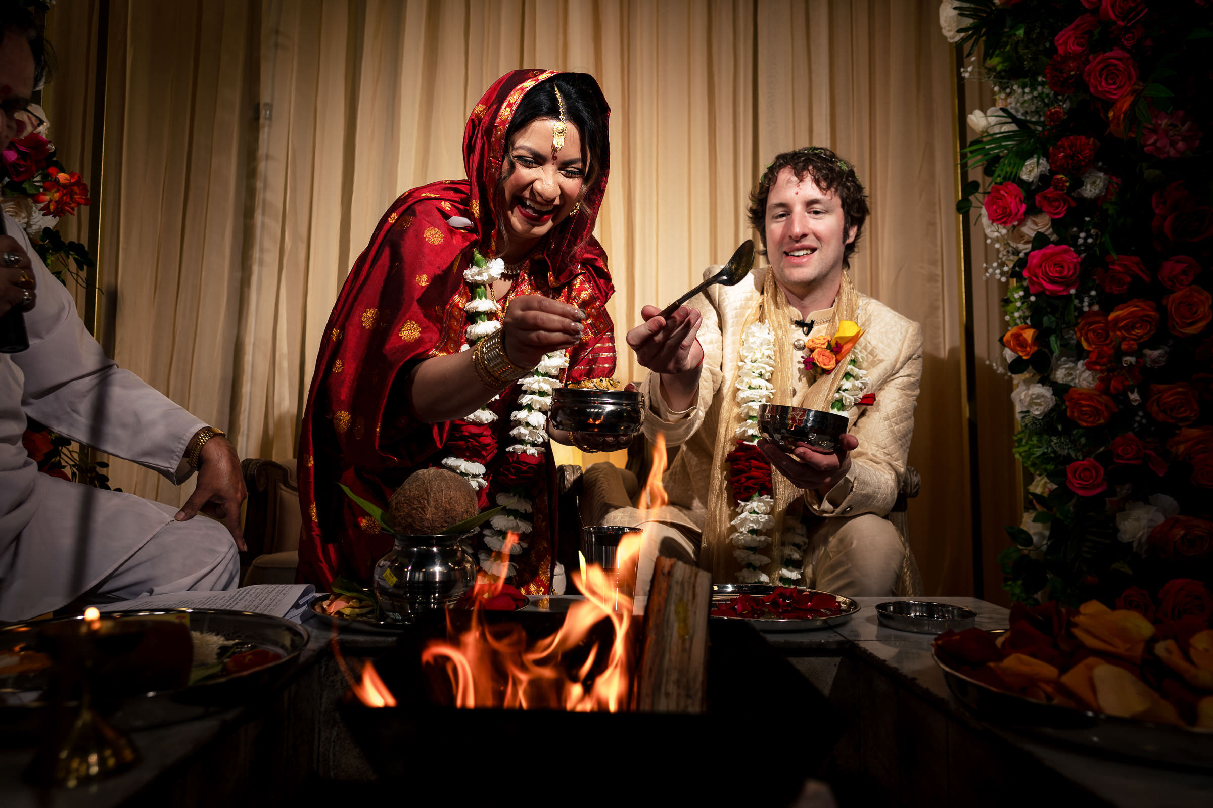 Couple celebrates Winnipeg wedding with fire and flower garlands.