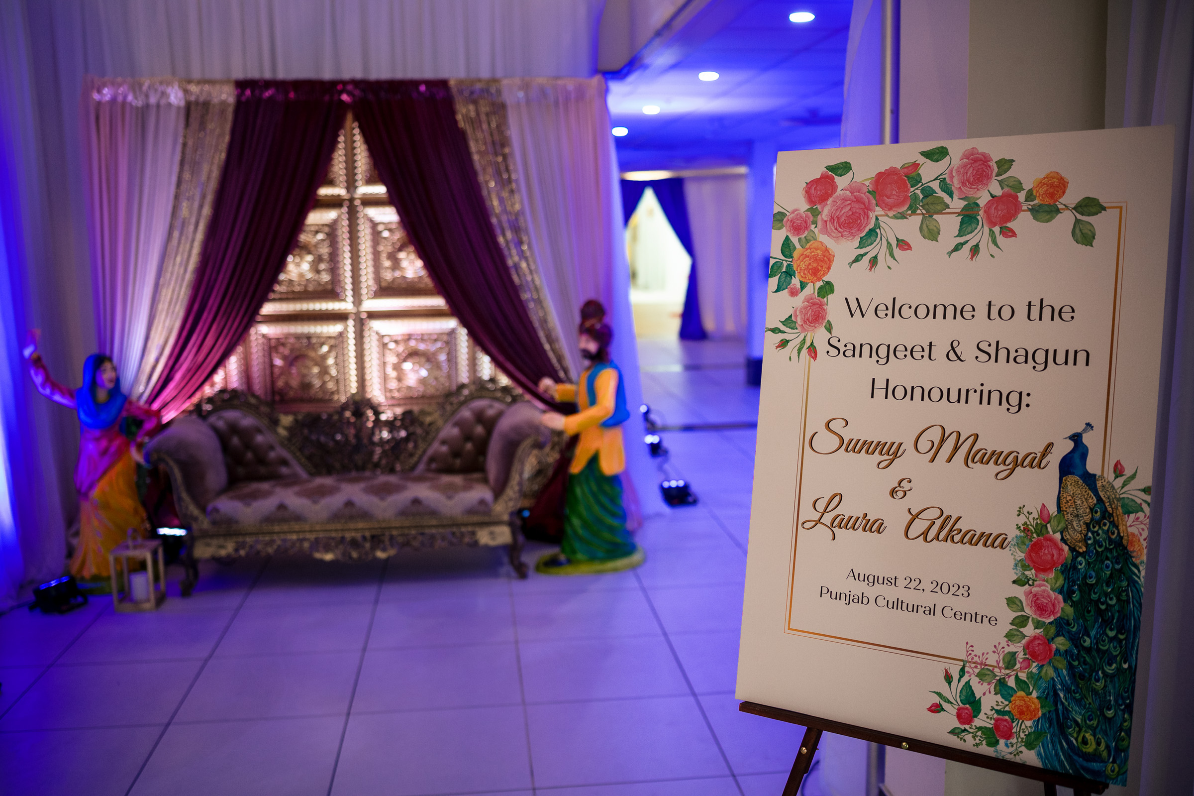 Decorative stage setup with a sign for Sangeet and Shagun event at Punjab Cultural Centre.