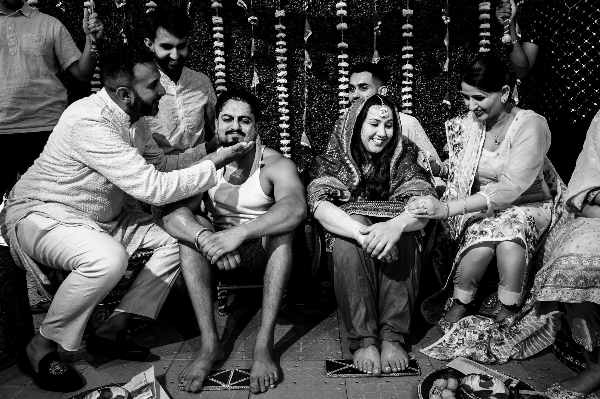 A group of people gathered, celebrating with traditional customs and decorations.