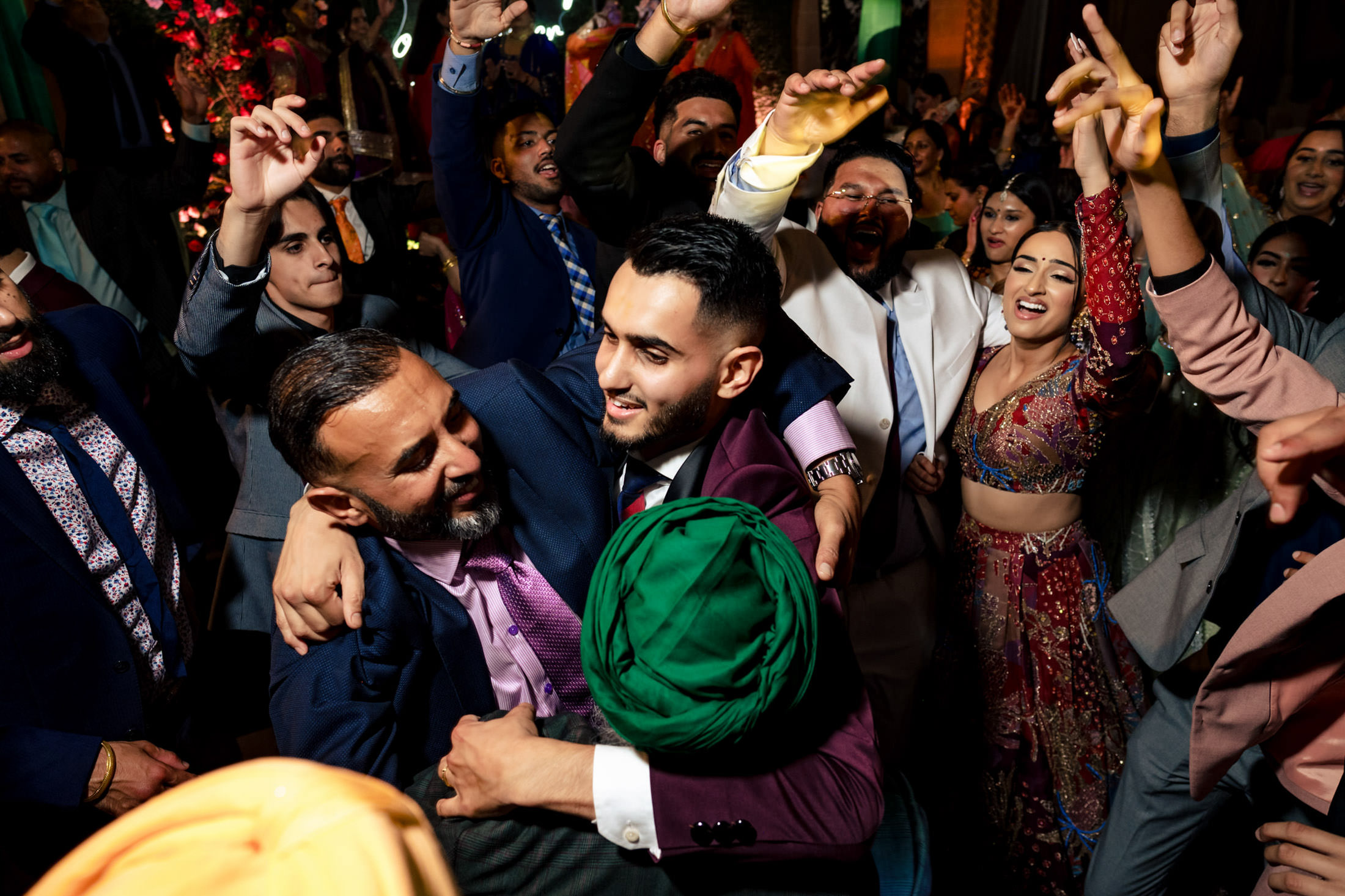 Winnipeg wedding guests dance joyfully at a lively celebration.