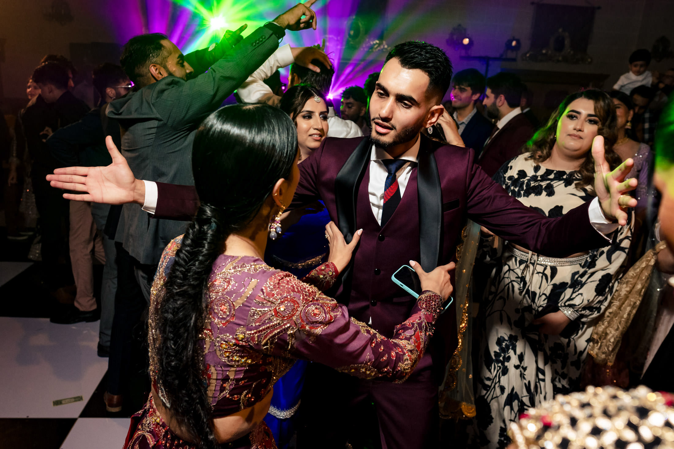 Energetic dancers light up the vibrant Winnipeg wedding celebration.