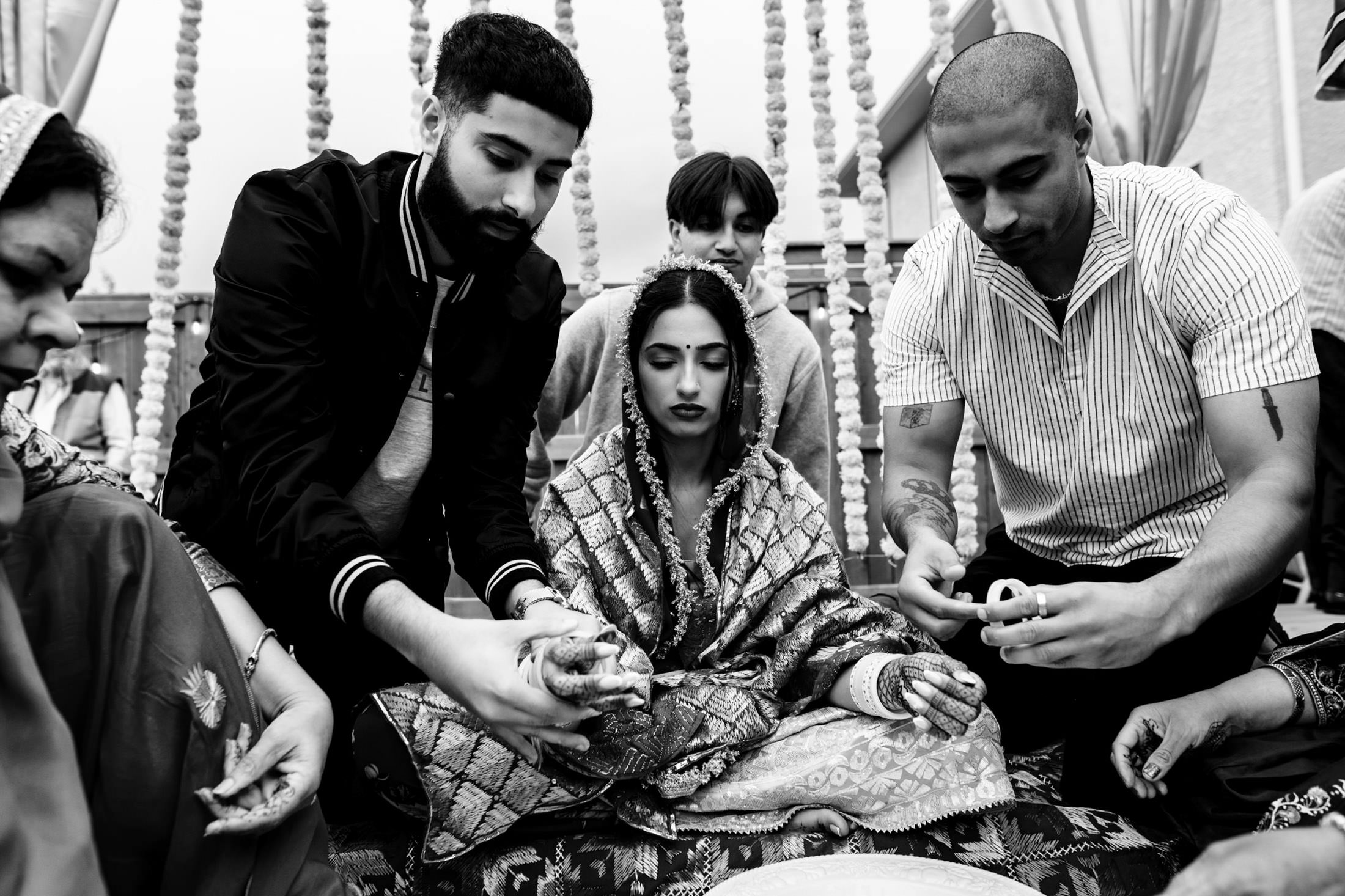 People in traditional attire prepare offerings at a Winnipeg wedding ceremony.