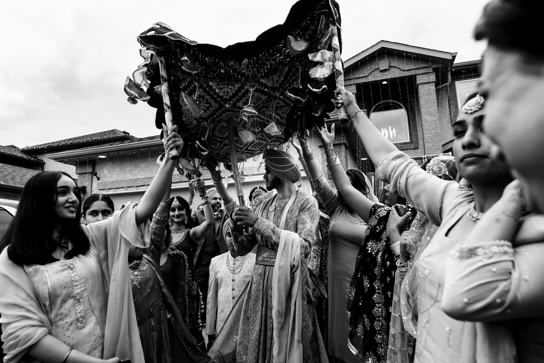 Black and white photo of a decorated canopy at a traditional Winnipeg wedding ceremony.