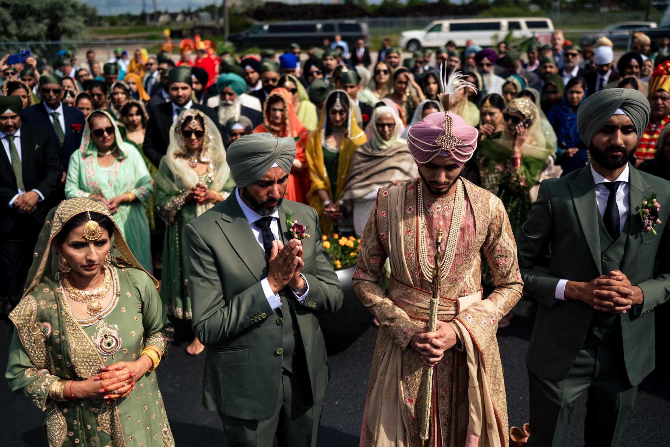 A gathering at a vibrant Winnipeg Sikh wedding, with colorful attire and traditional garments.