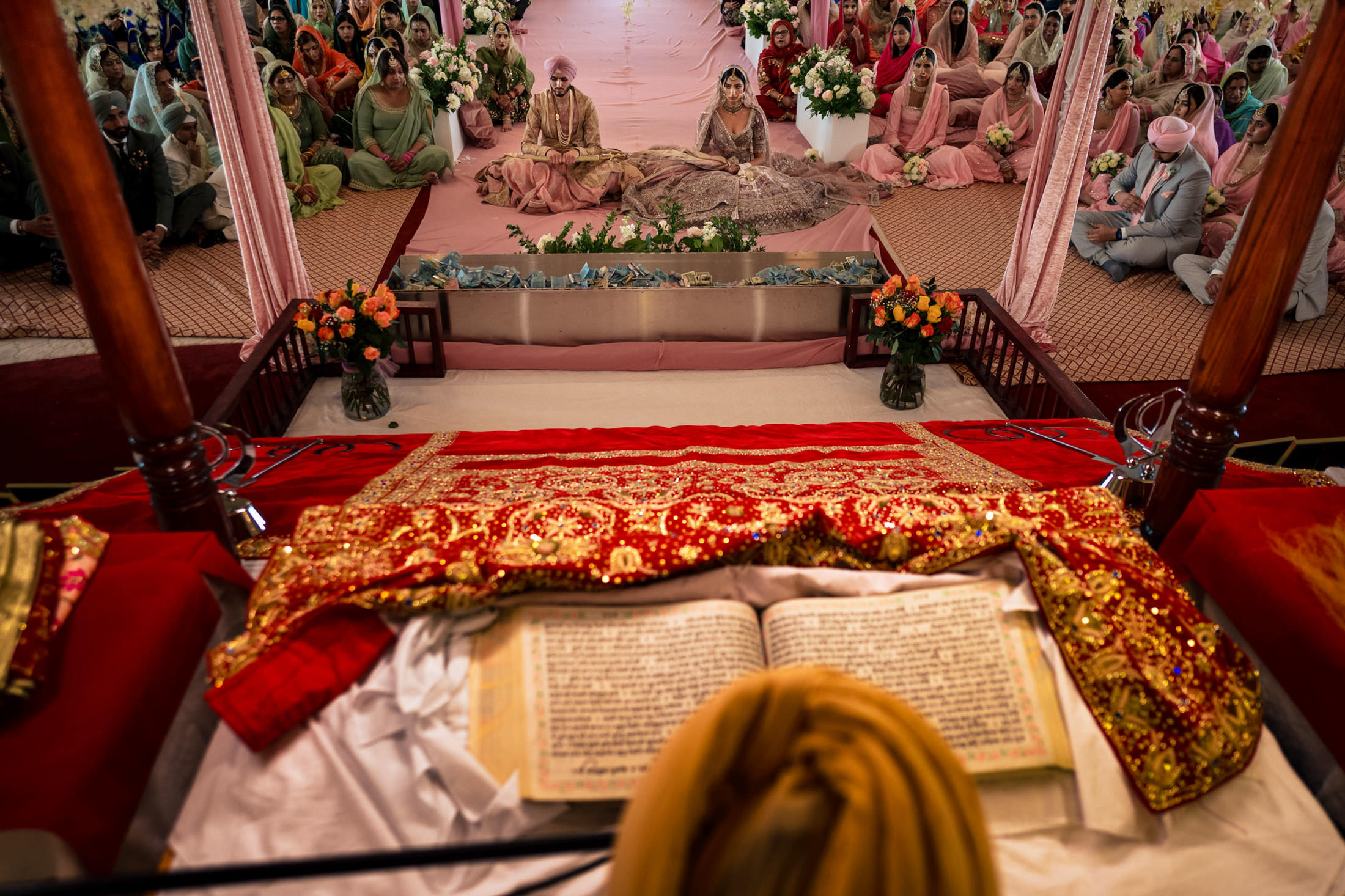 Winnipeg wedding with a couple in traditional attire, surrounded by joyful guests.