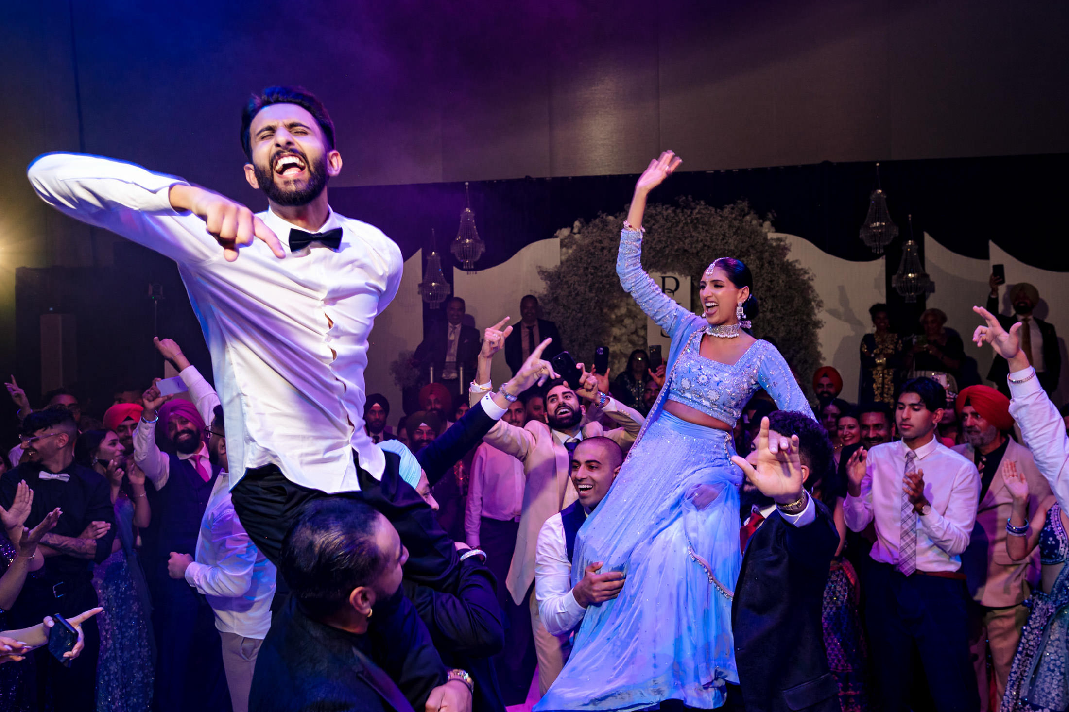 Energetic dancing at a lively Winnipeg wedding celebration.