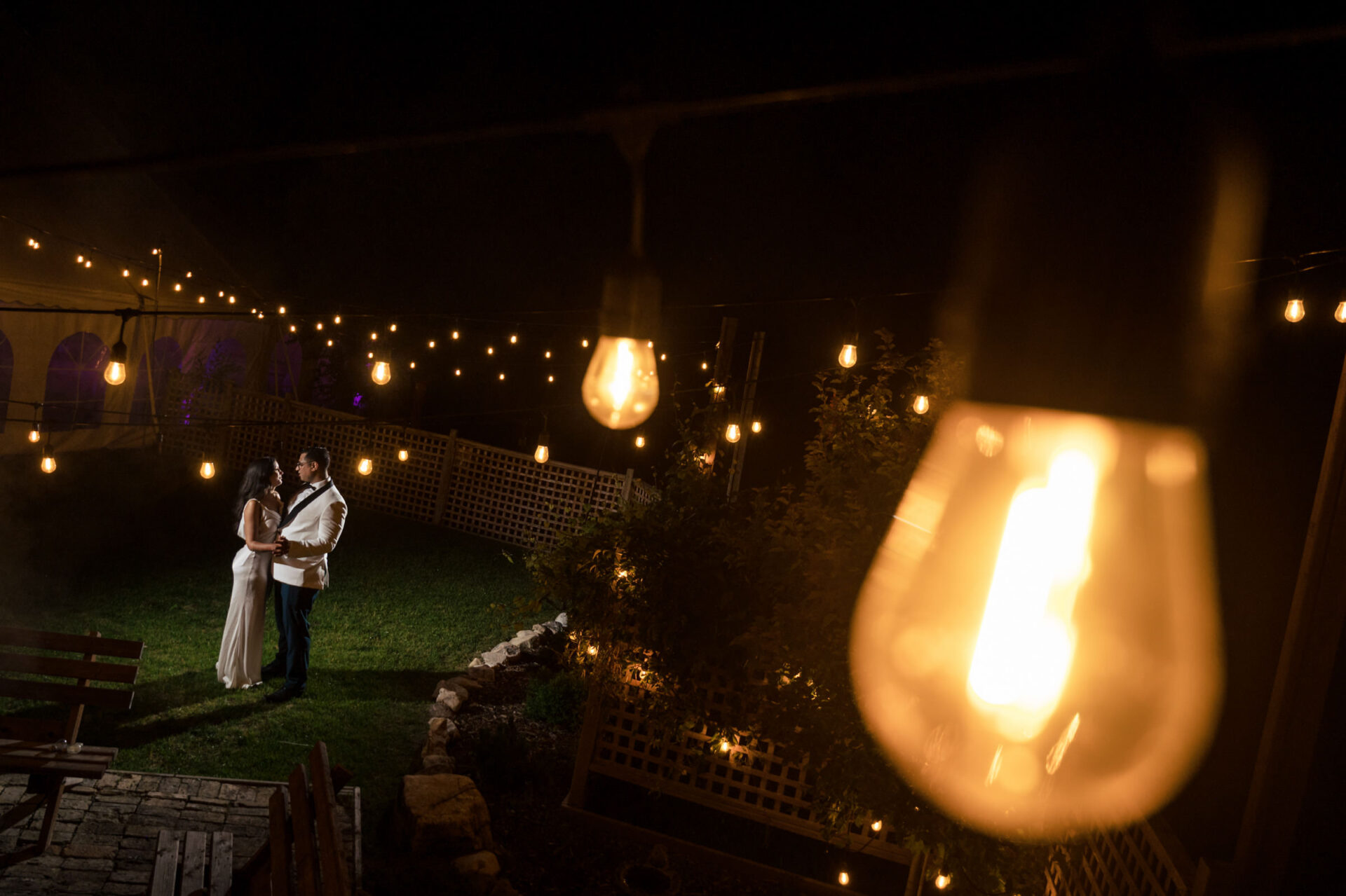 Couple dancing under string lights at night, a Best Winnipeg Wedding Photos moment.