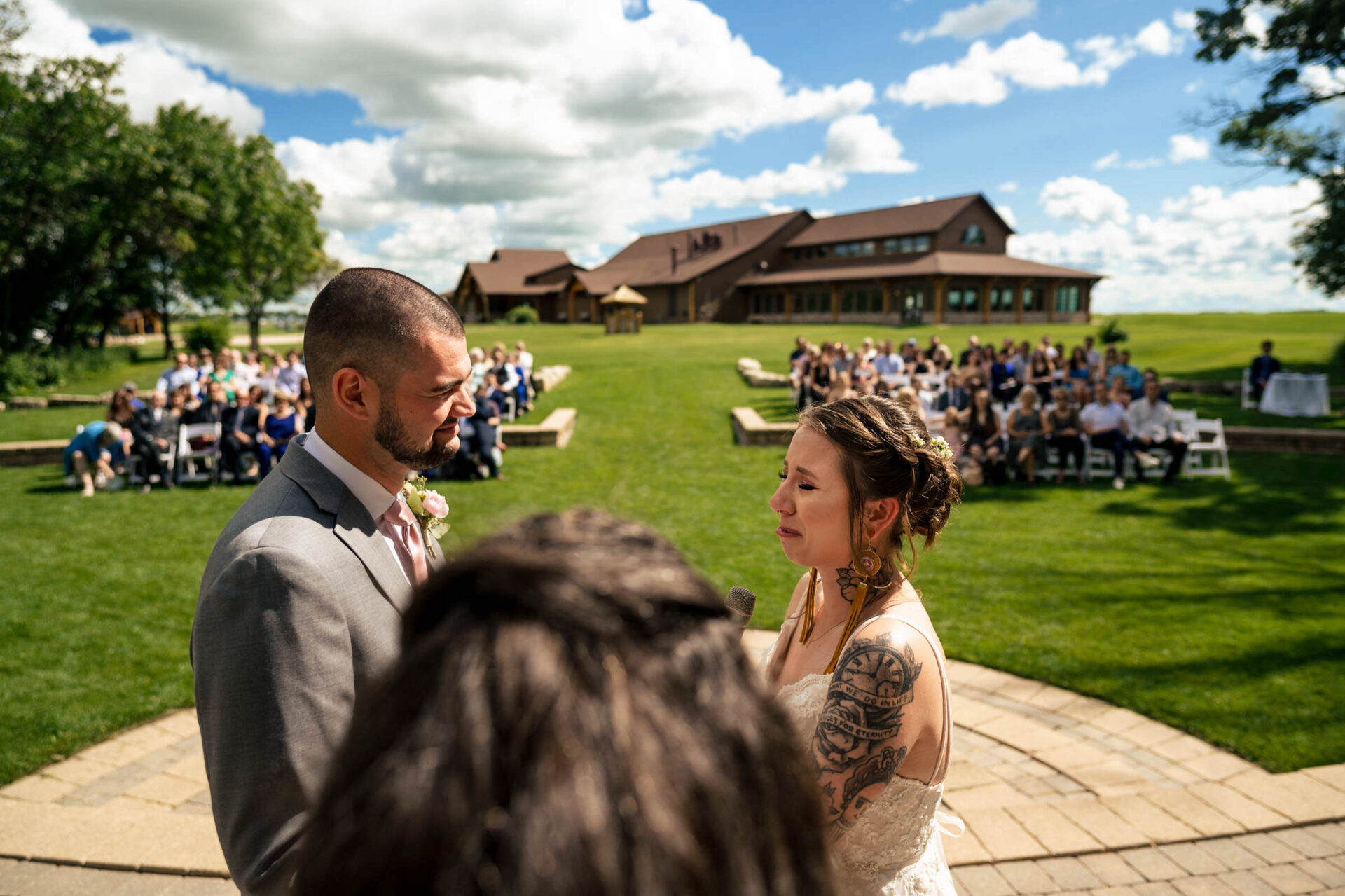 Bride and groom exchange vows outdoors, capturing the best Winnipeg wedding photos.