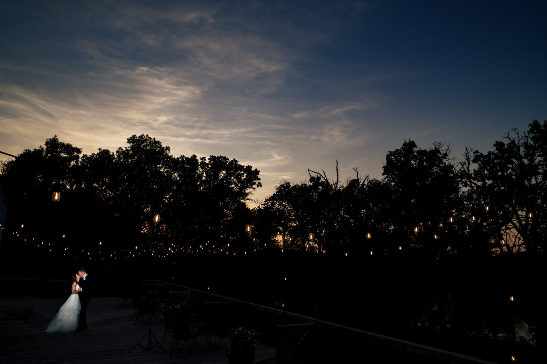 Dancing under string lights, their love shines like best Winnipeg wedding photos.