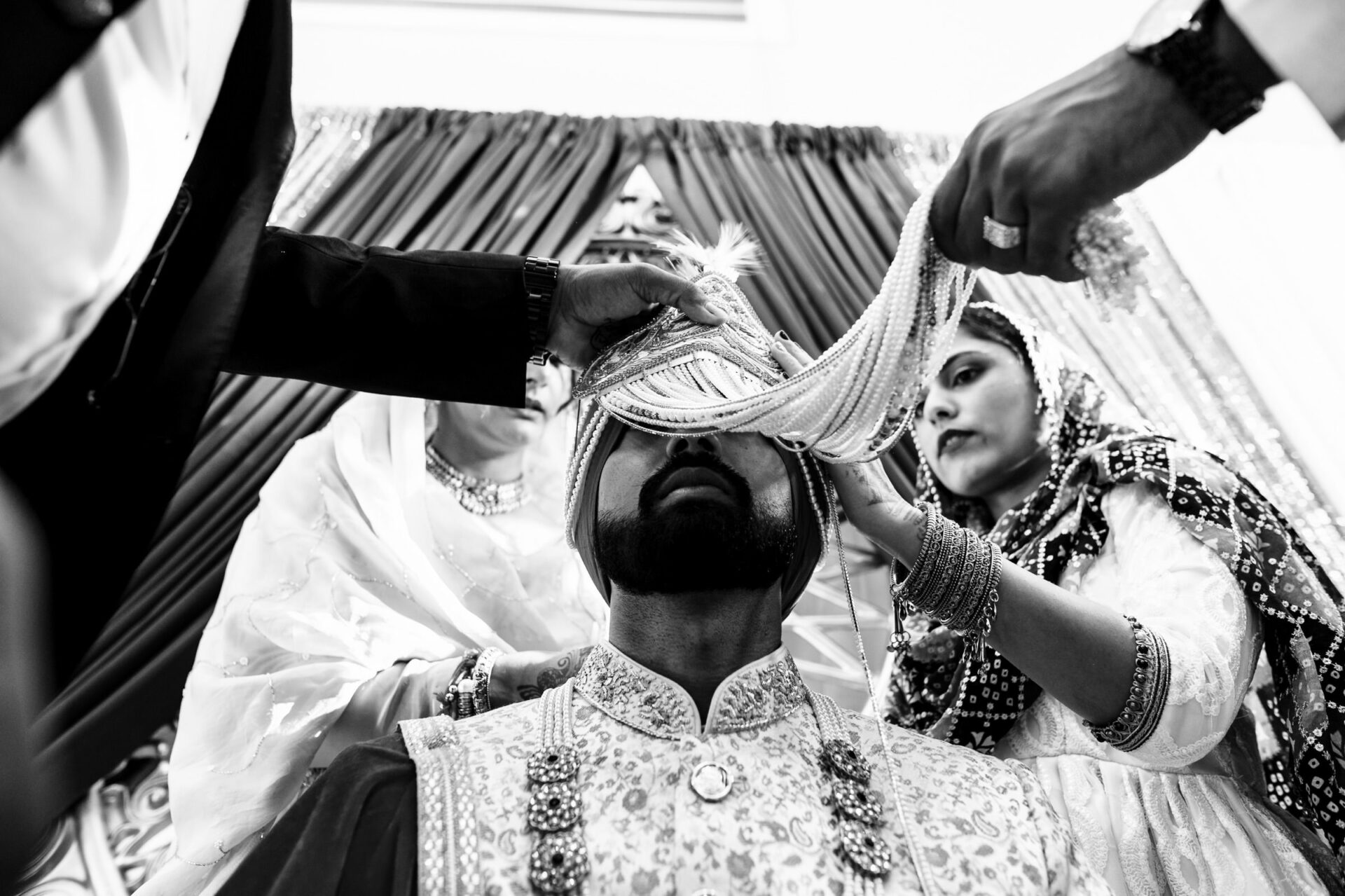 A groom dons a headpiece, captured in the best Winnipeg wedding photos.