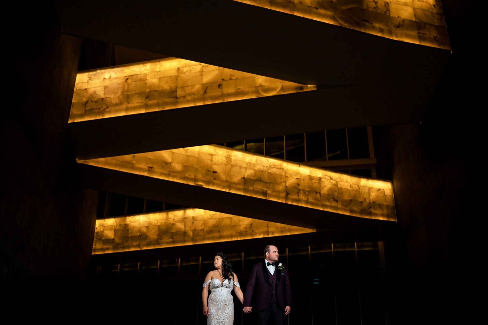 Bride and groom beneath golden lighting capture best Winnipeg wedding photo moments.