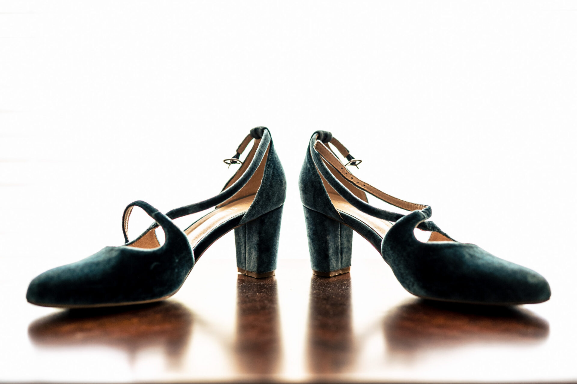 Velvet heels with ankle straps shine in the best Winnipeg wedding photos.