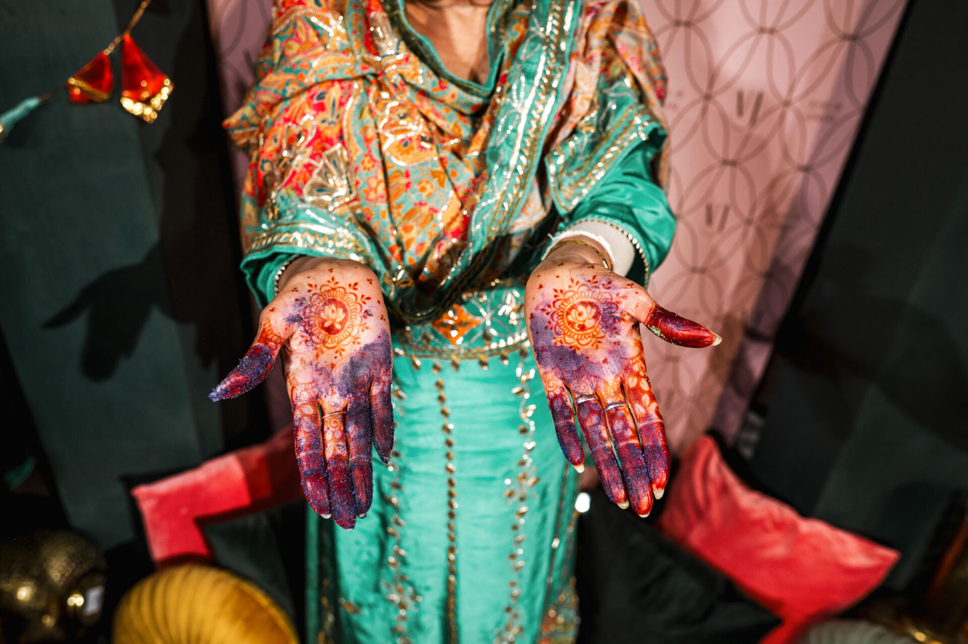 Person in colorful clothes flaunts intricate henna, perfect for a Sikh or Hindu wedding.
